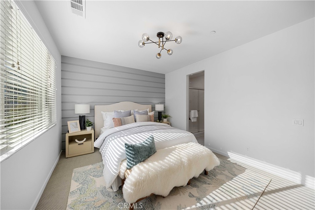 108 Citysquare Irvine, CA 92614 - Photo 22 of 45 a spacious bedroom with a bed and window