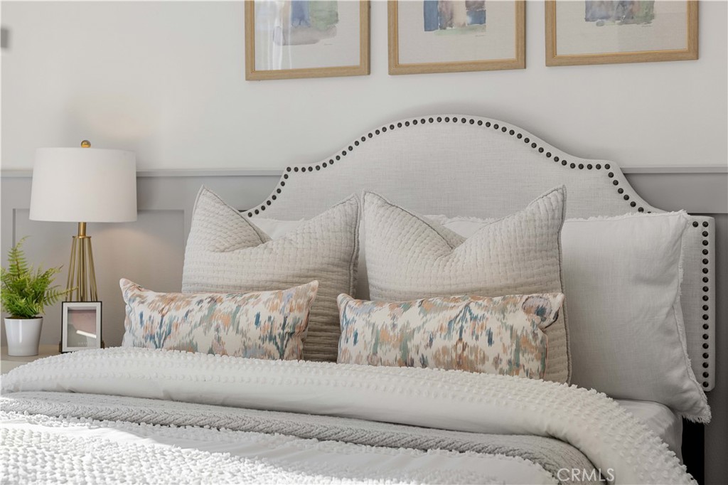 108 Citysquare Irvine, CA 92614 - Photo 33 of 45 a living room with a couch and a potted plant