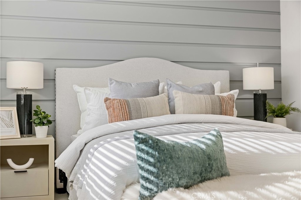 108 Citysquare Irvine, CA 92614 - Photo 42 of 45 a bedroom with a bed and a lamp