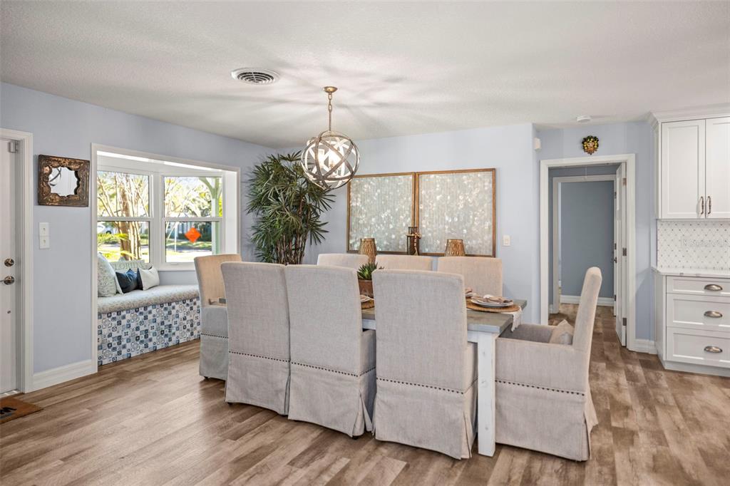 400 Broadway Dunedin, FL 34698 - Photo 5 of 84 a living room with furniture a chandelier and a wooden floor