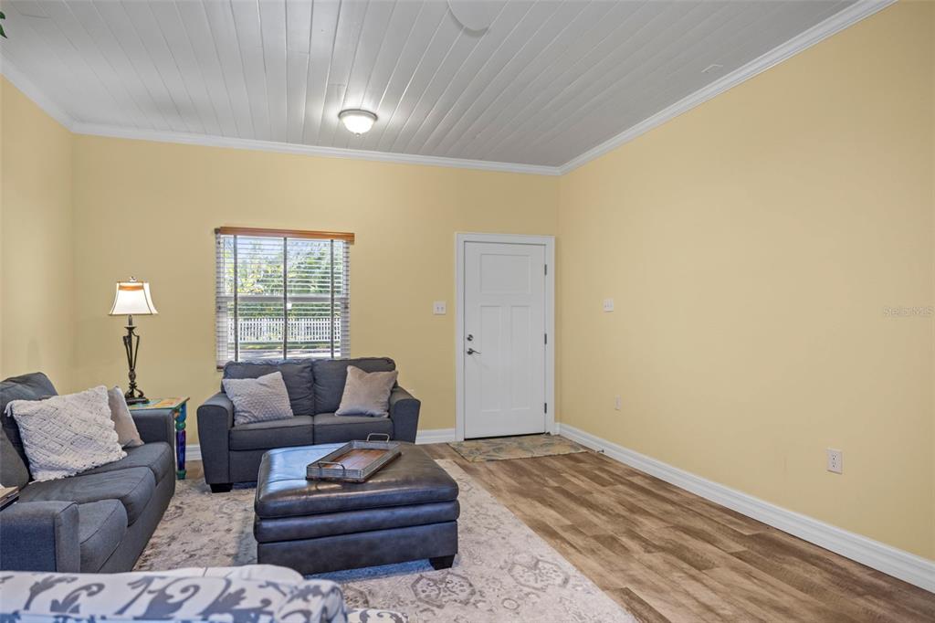 400 Broadway Dunedin, FL 34698 - Photo 55 of 84 a living room with furniture and a potted plant
