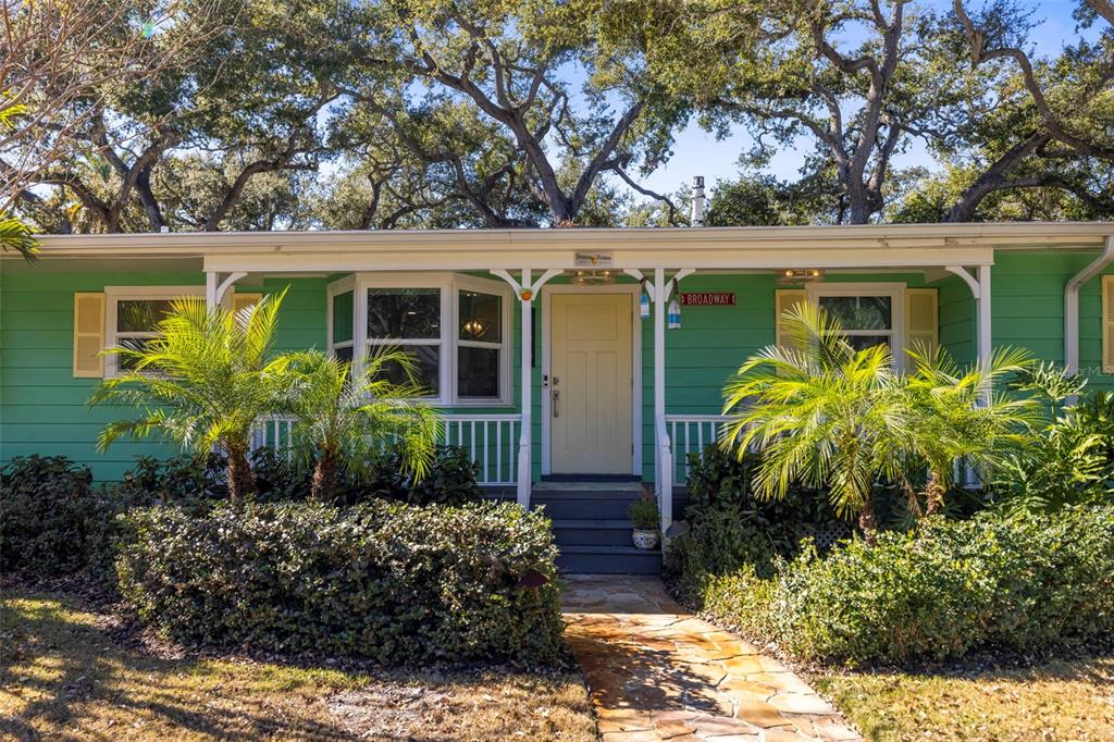 400 Broadway Dunedin, FL 34698 - Photo 59 of 84 front view of a house with a small yard
