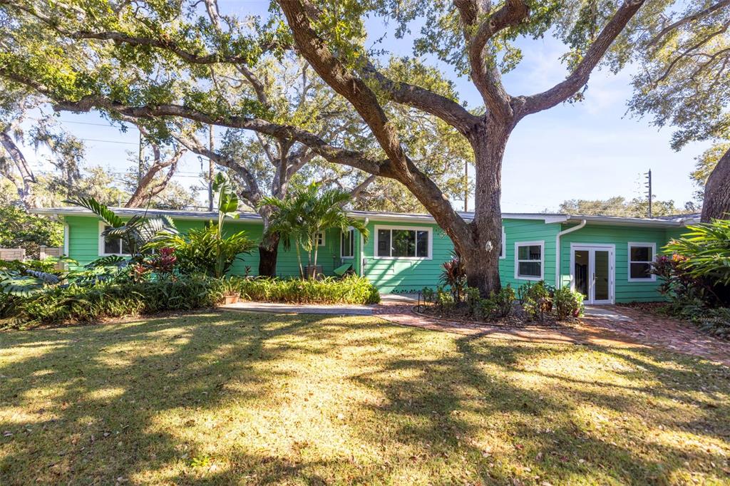 400 Broadway Dunedin, FL 34698 - Photo 79 of 84 a view of a house with backyard and a tree