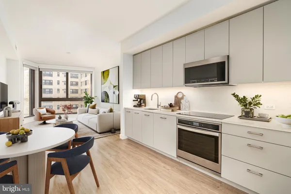 a kitchen with a sink stove and microwave