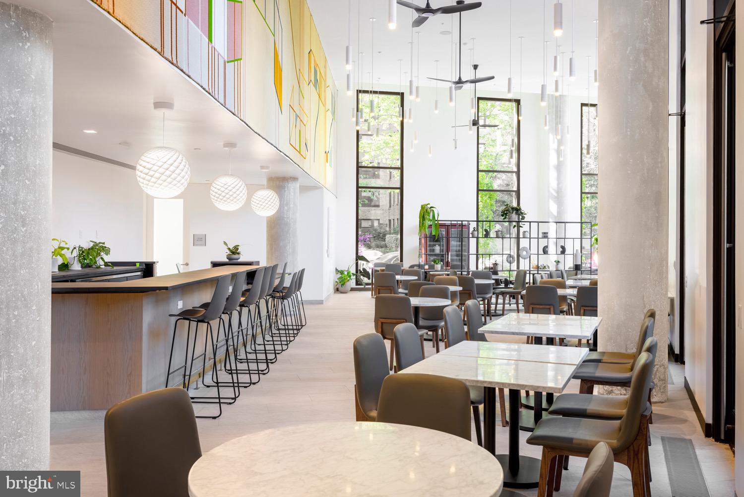 1630 Columbia Road Northwest, Unit 513 Washington, DC 20009 - Photo 15 of 22 a view of a dining room with furniture window and outside view