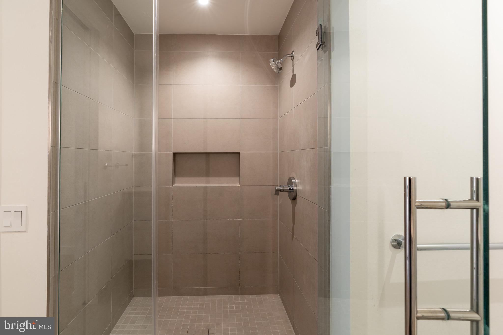 1630 Columbia Road Northwest, Unit 513 Washington, DC 20009 - Photo 8 of 22 a bathroom with a shower