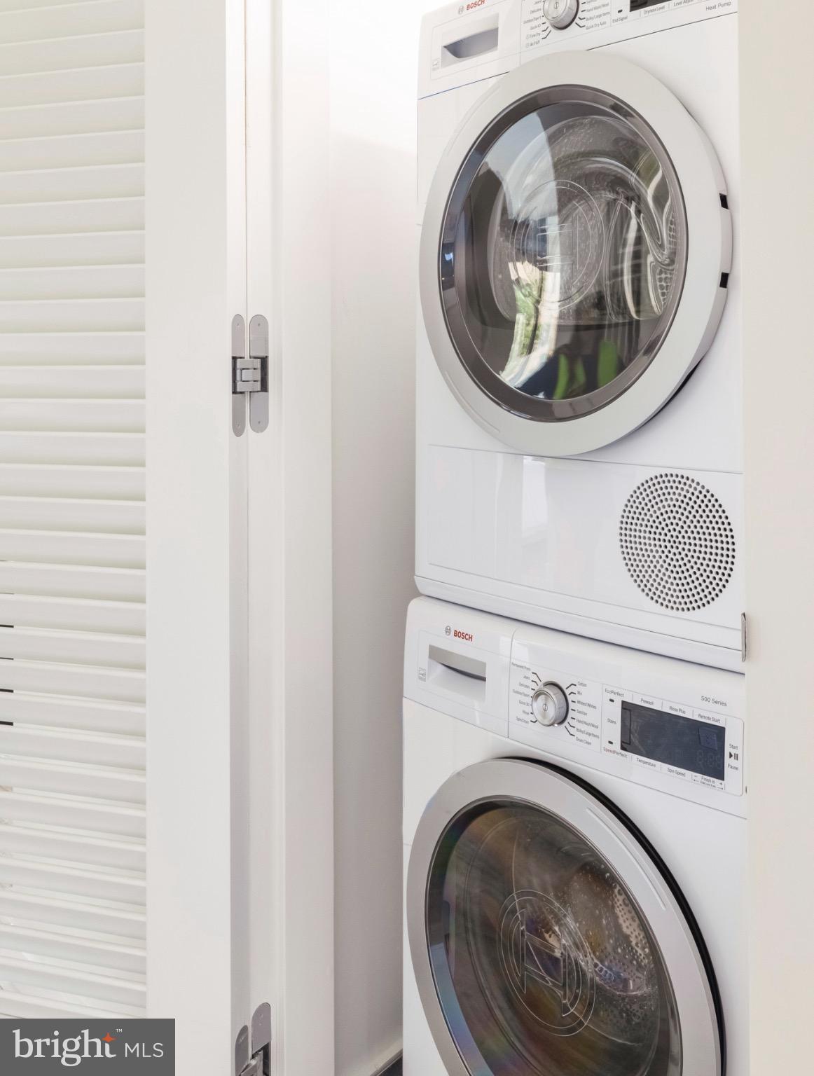 1630 Columbia Road Northwest, Unit 513 Washington, DC 20009 - Photo 9 of 22 a utility room with dryer and washer