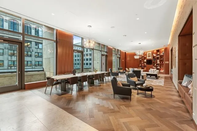 a large kitchen with a table and chairs