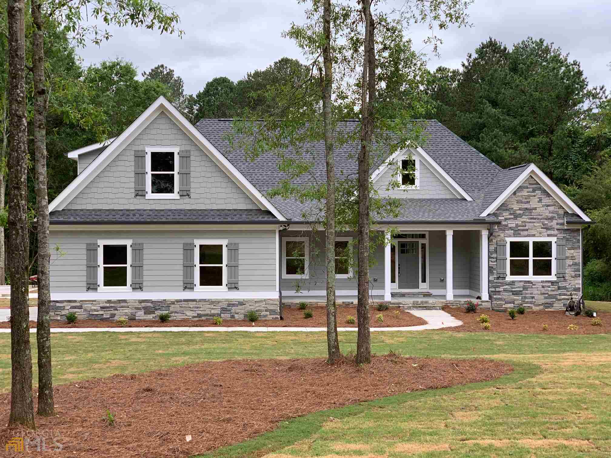 a front view of house with yard and green space