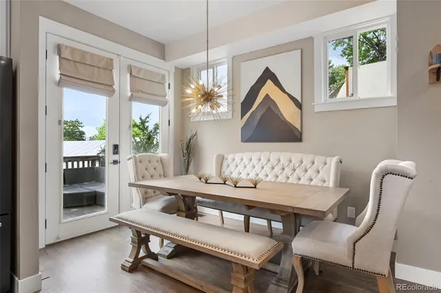 a dining room with furniture and window