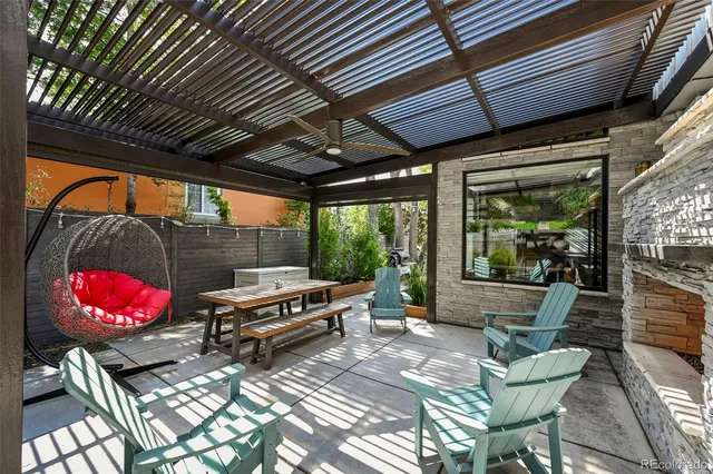 a outdoor living space with furniture and a fireplace