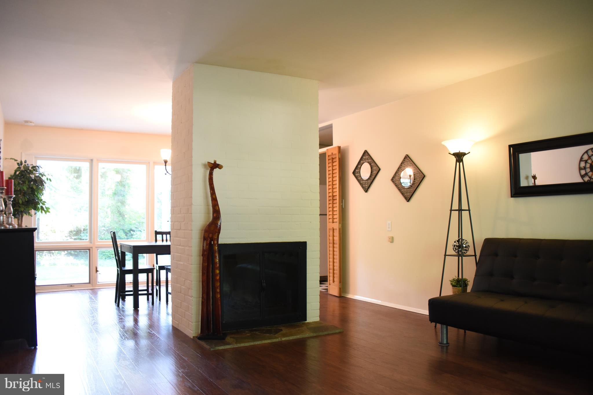 5407 Ferndale Street Springfield, VA 22151 - Photo 2 of 14 a living room with furniture and a fireplace