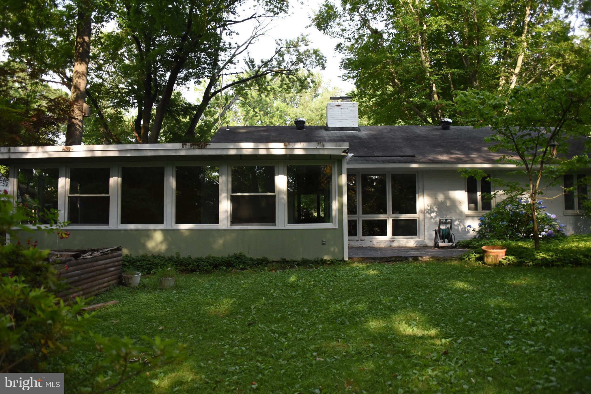 5407 Ferndale Street Springfield, VA 22151 - Photo 14 of 14 a view of a house with a garden and plants