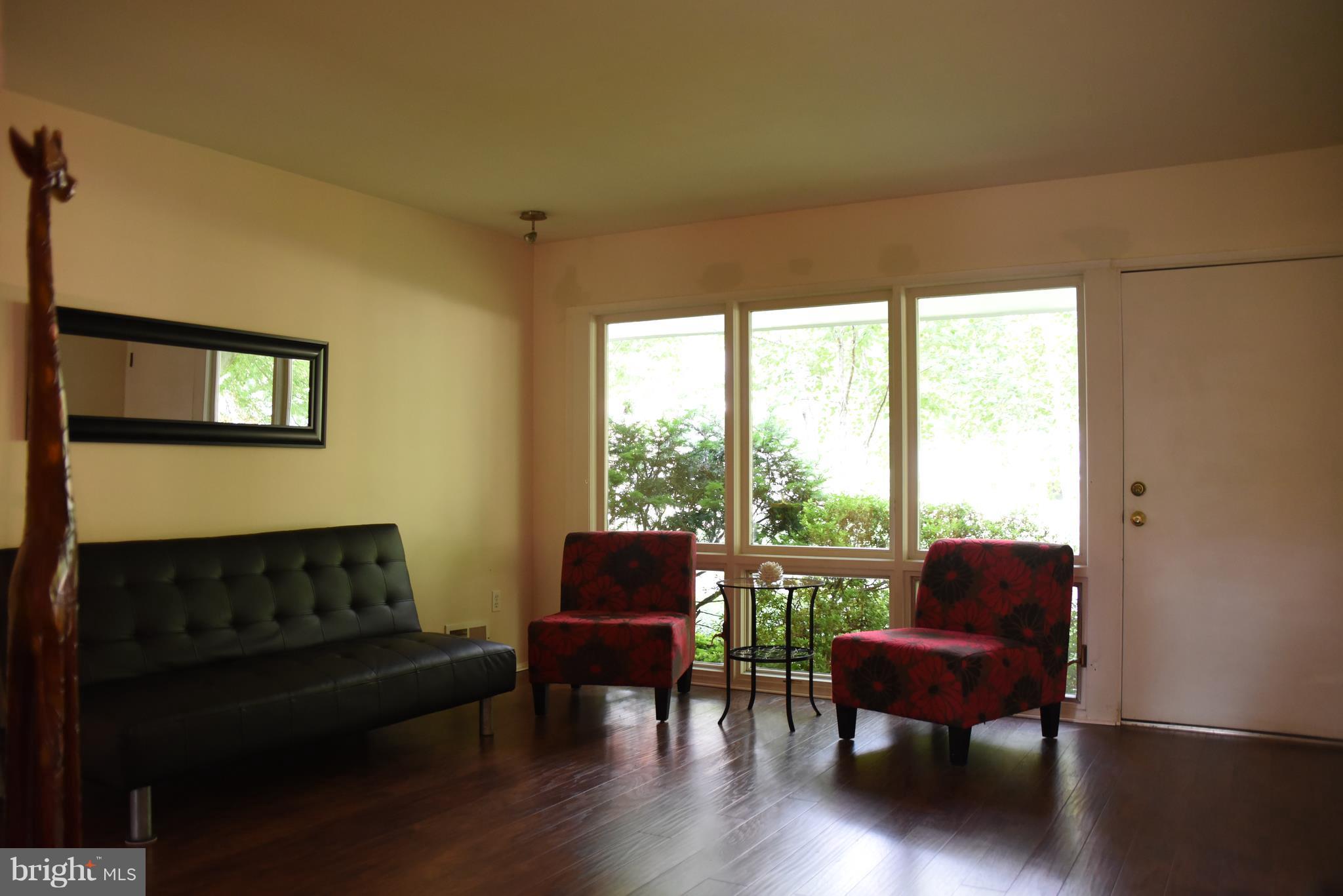 5407 Ferndale Street Springfield, VA 22151 - Photo 3 of 14 a living room with furniture and a window