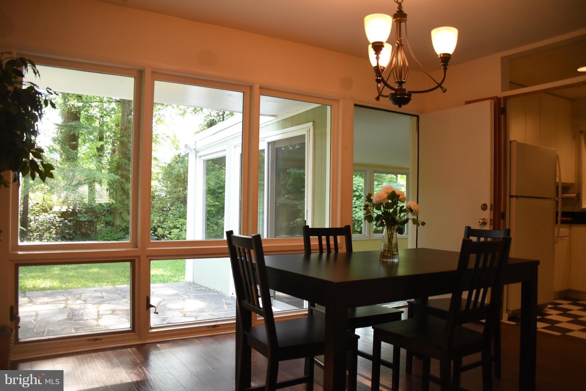 5407 Ferndale Street Springfield, VA 22151 - Photo 5 of 14 a view of a dining room with furniture window and wooden floor
