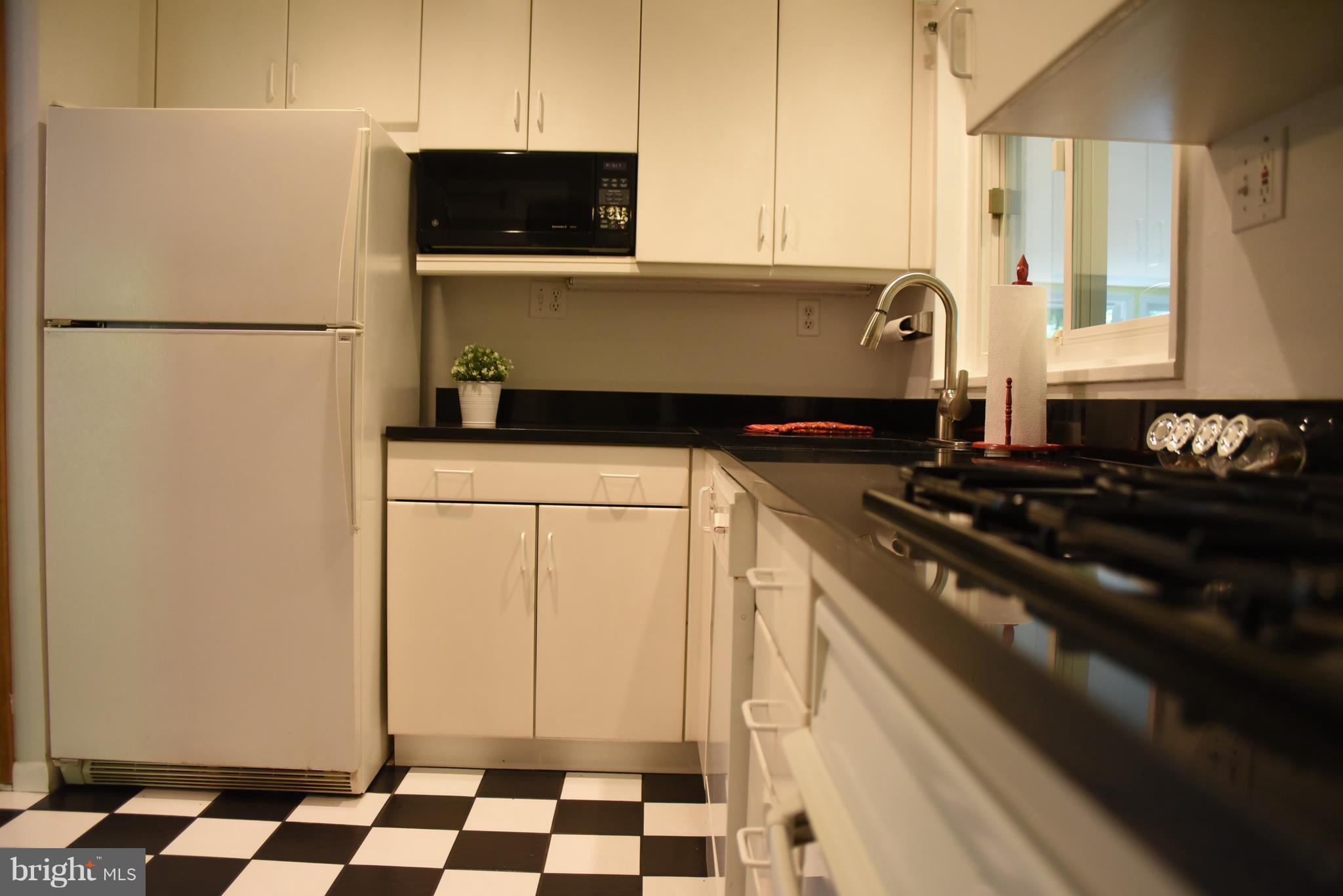 5407 Ferndale Street Springfield, VA 22151 - Photo 6 of 14 a kitchen with a refrigerator and a stove