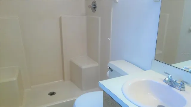 a bathroom with a sink and toilet