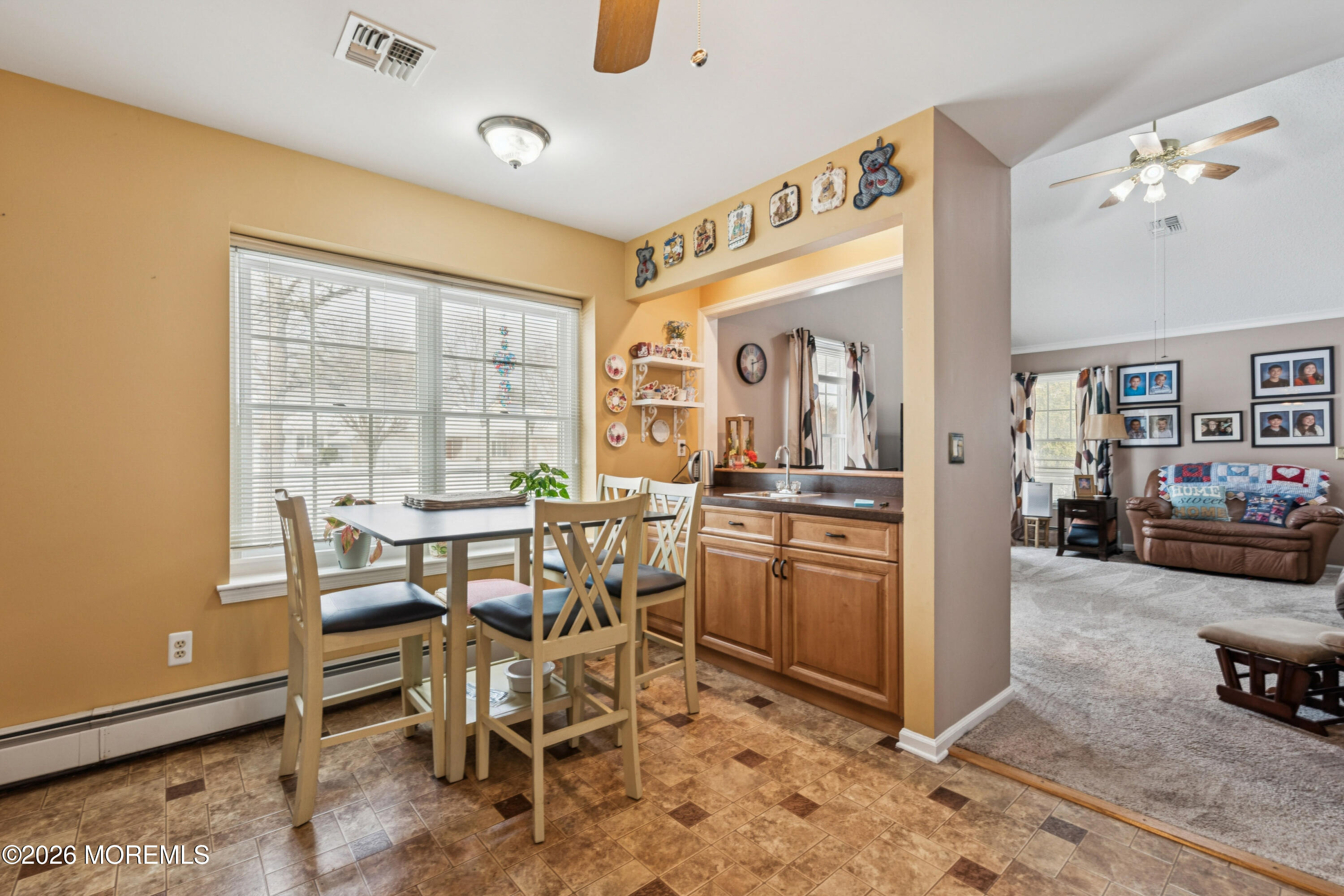 1583 Goldspire Road Toms River, NJ 08755 - Photo 4 of 18 a view of a dining room with furniture and a chandelier