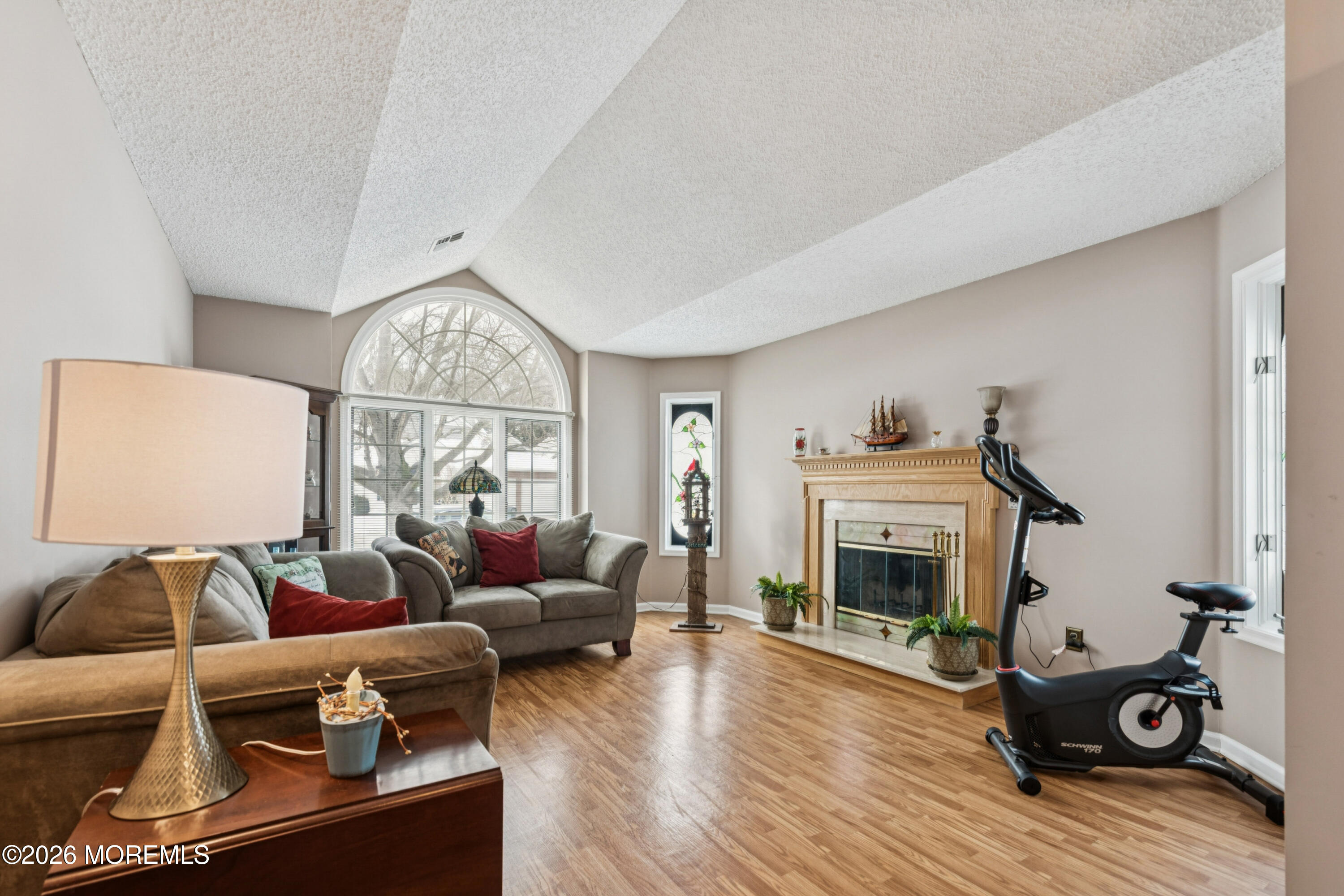 1583 Goldspire Road Toms River, NJ 08755 - Photo 6 of 18 a living room with furniture a fireplace and wooden floor