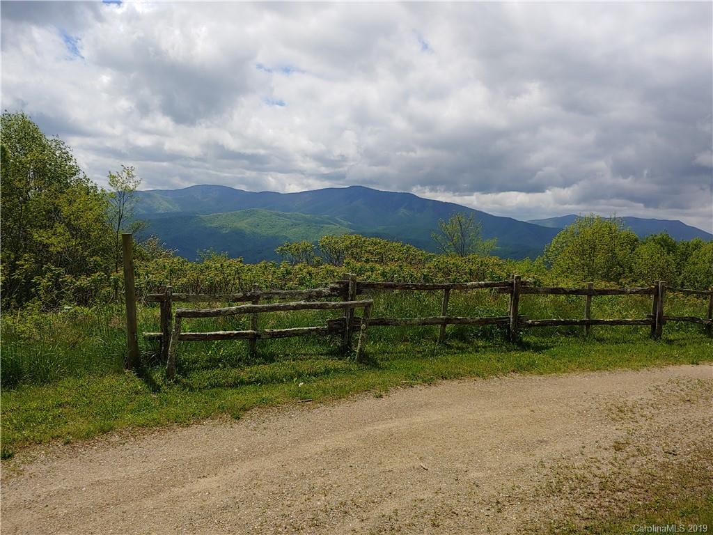Lot 29 Ridge Top Circle Road, Unit LOT 29 Clyde, NC 28721 - Photo 1 of 22 a view of a bench in front of a house