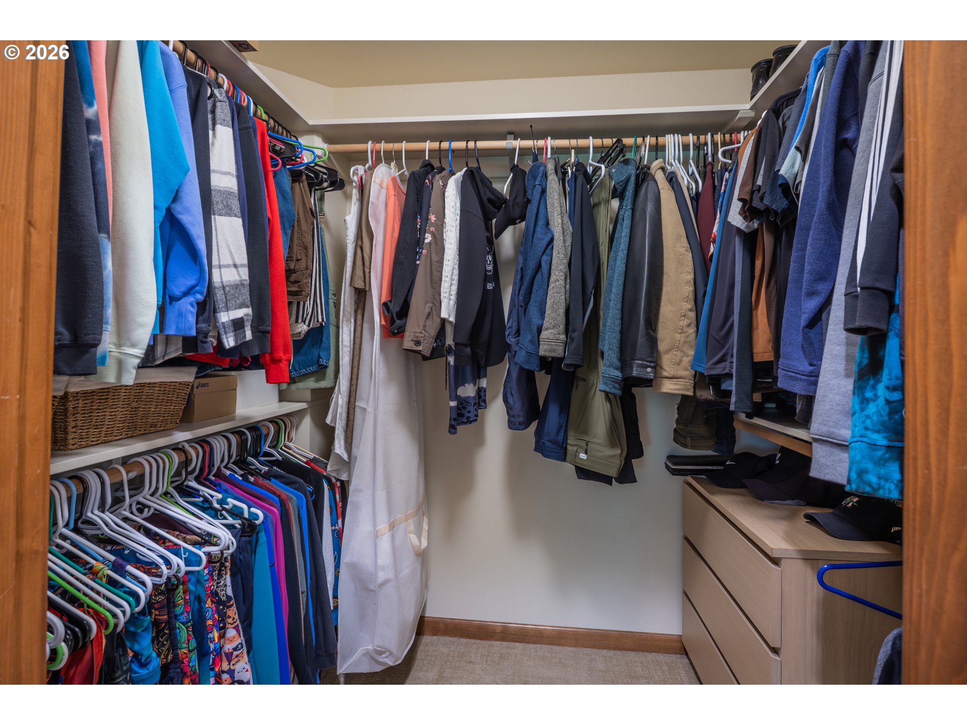 2193 13th Street Florence, OR 97439 - Photo 38 of 48 a view of walk in closet with clothes