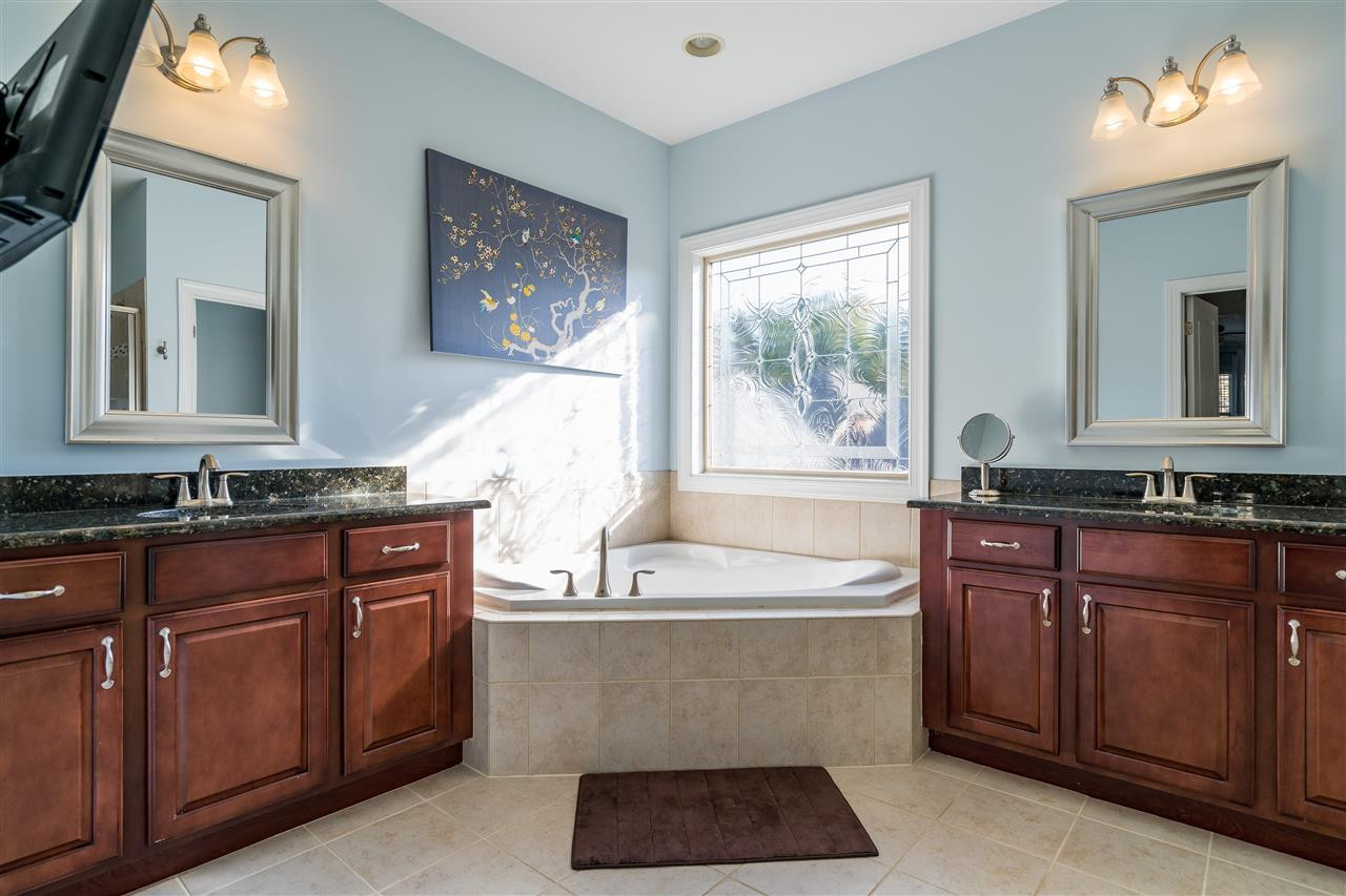 1528 Rodessa Run Raleigh, NC 27607 - Photo 23 of 30 Ceramic tile, two separate sinks, granite counters, garden tub, separate shower, separate water closet. Owner's Suite Bathroom
