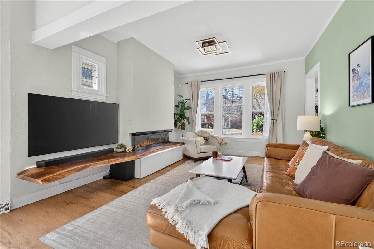 854 South Clarkson Street Denver, CO 80209 - Photo 11 of 50 a living room with furniture and a flat screen tv