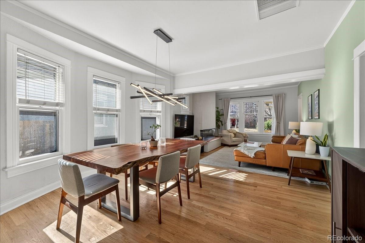 854 South Clarkson Street Denver, CO 80209 - Photo 14 of 50 a view of a dining room with furniture window and wooden floor