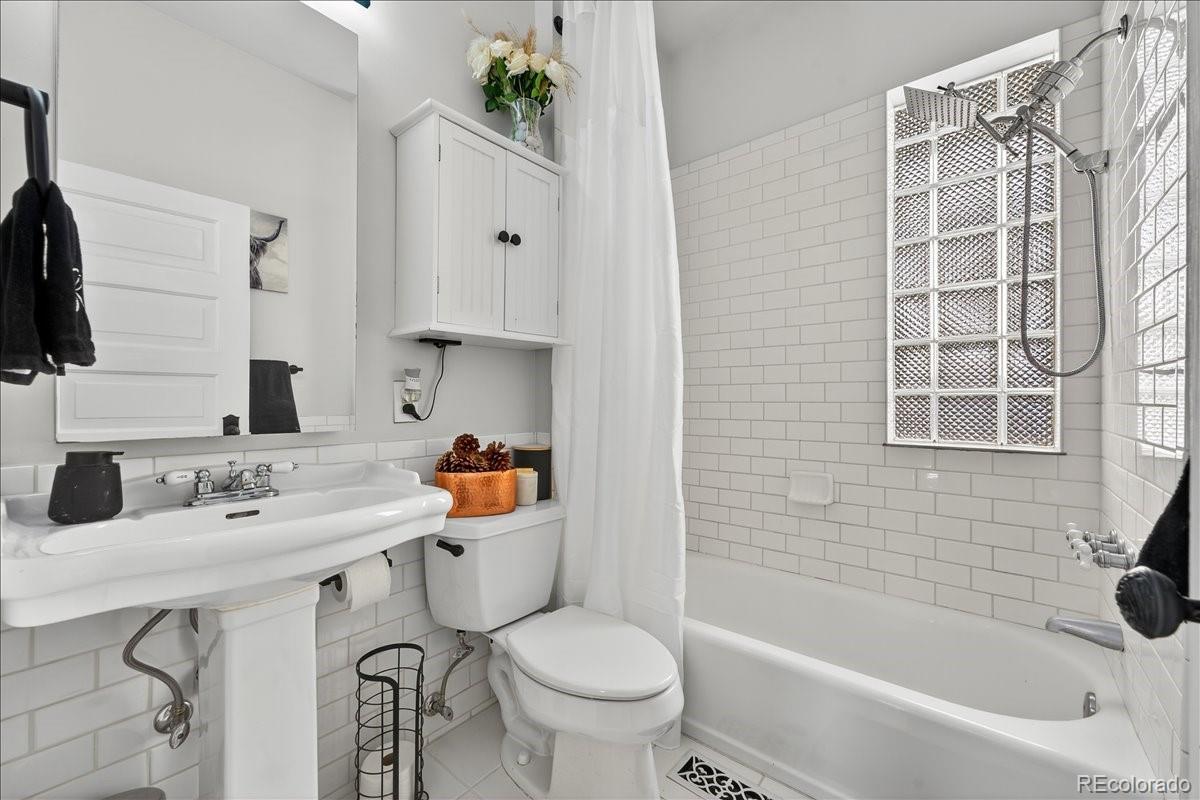 854 South Clarkson Street Denver, CO 80209 - Photo 30 of 50 a bathroom with a sink toilet and shower