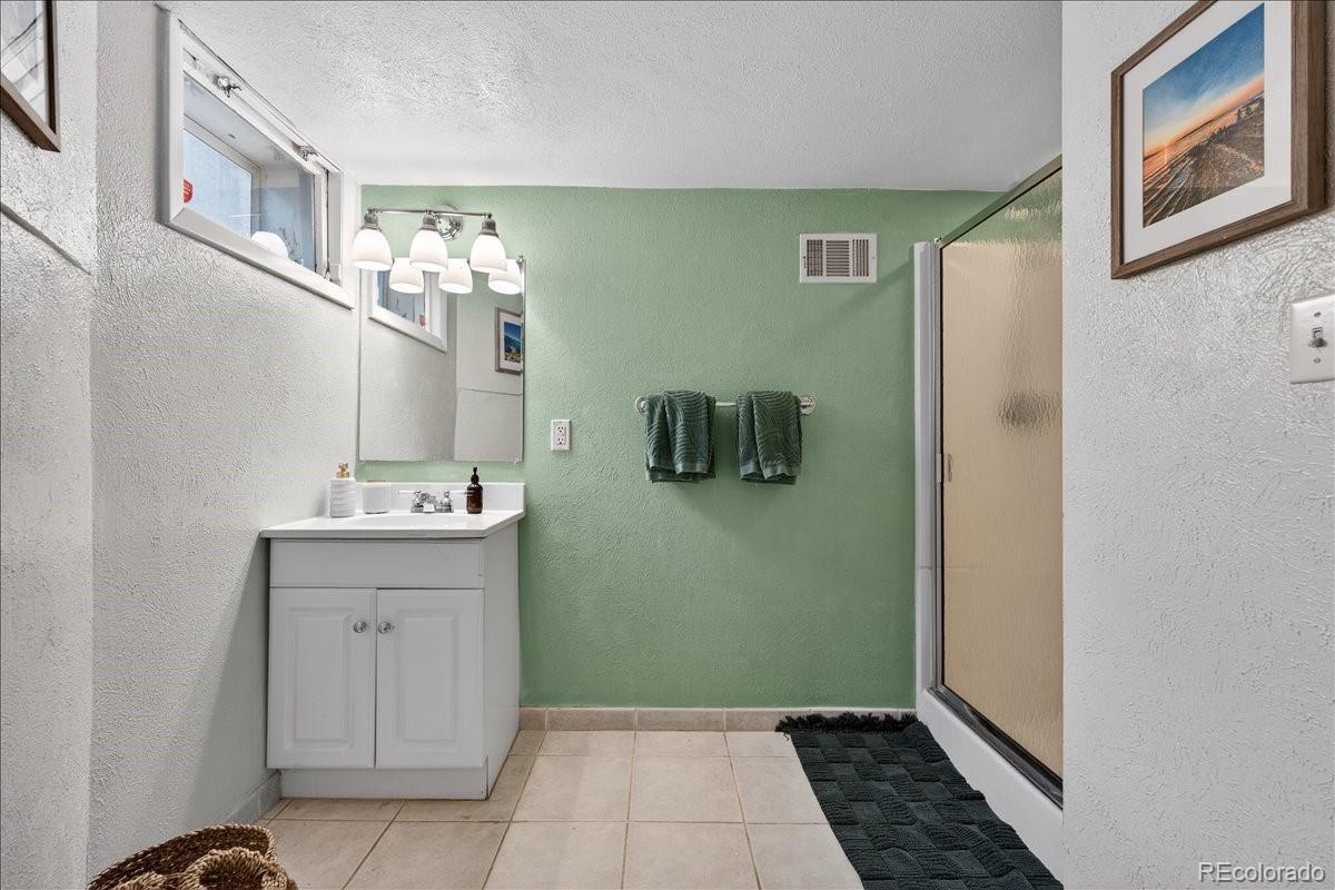 854 South Clarkson Street Denver, CO 80209 - Photo 37 of 50 a room with painting and a potted plant