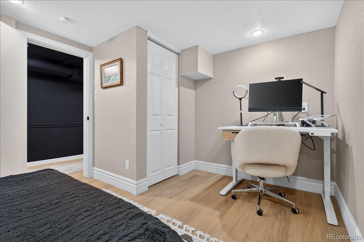 854 South Clarkson Street Denver, CO 80209 - Photo 39 of 50 a workspace with furniture and wooden floor