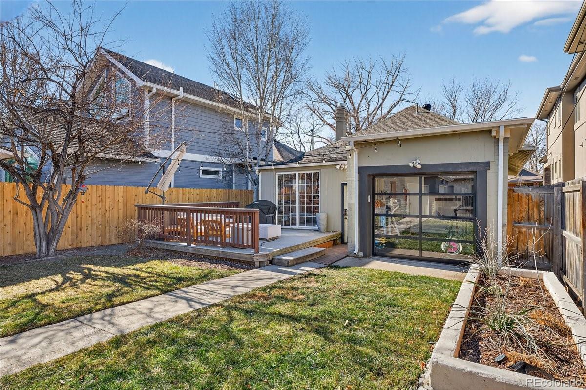 854 South Clarkson Street Denver, CO 80209 - Photo 41 of 50 a view of a house with a yard patio and fire pit