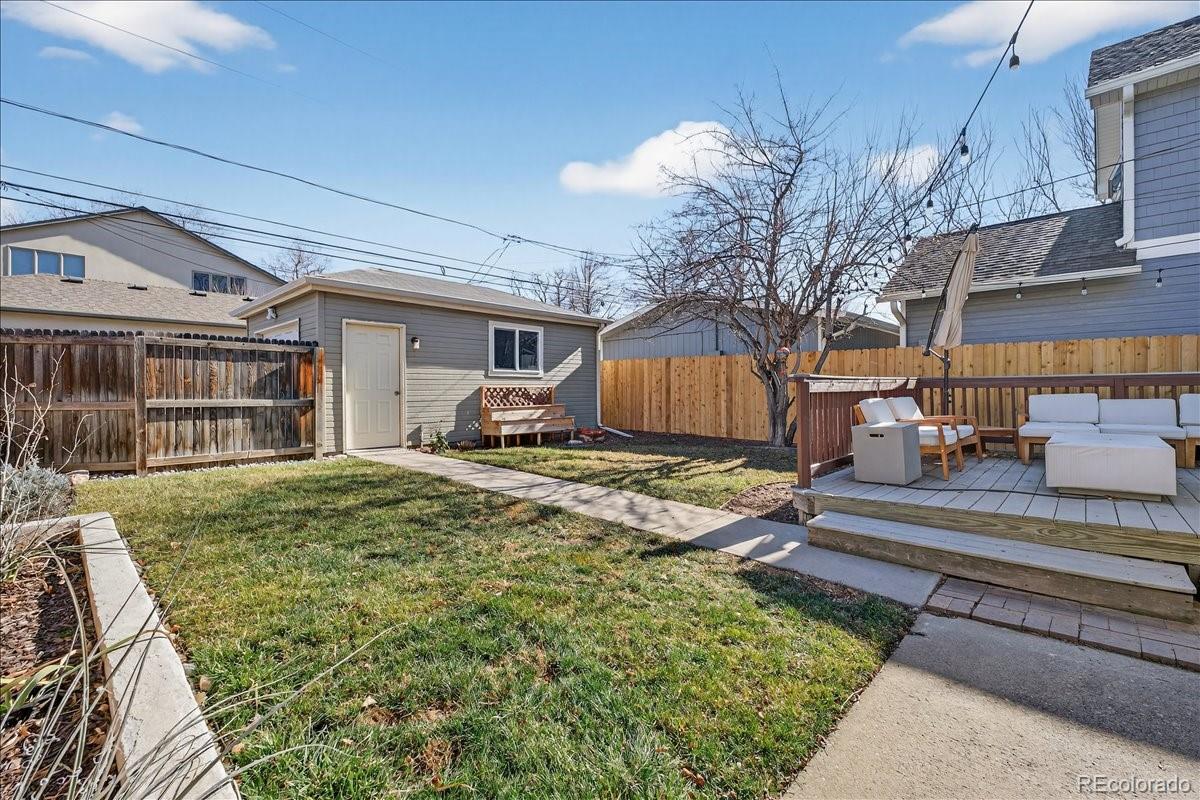 854 South Clarkson Street Denver, CO 80209 - Photo 45 of 50 a view of a house with a big yard and large tree