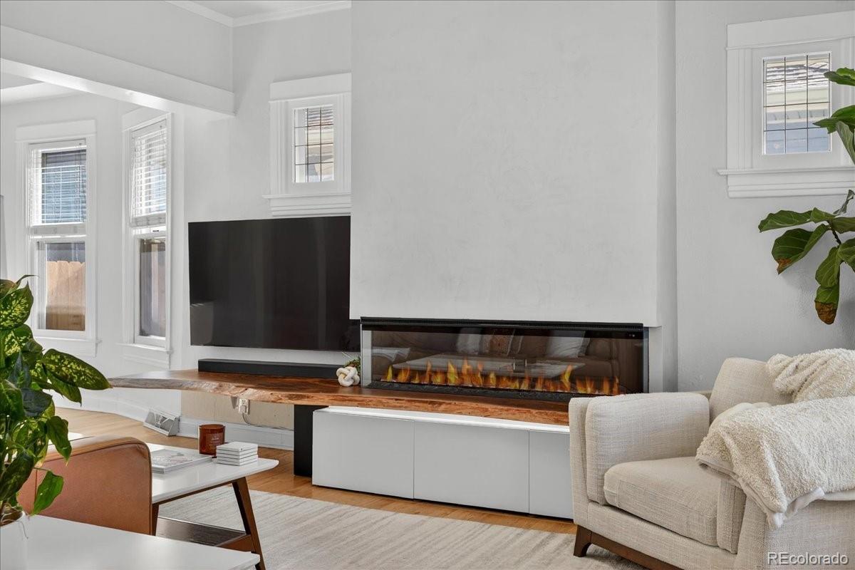 854 South Clarkson Street Denver, CO 80209 - Photo 10 of 50 a living room with furniture and a flat screen tv