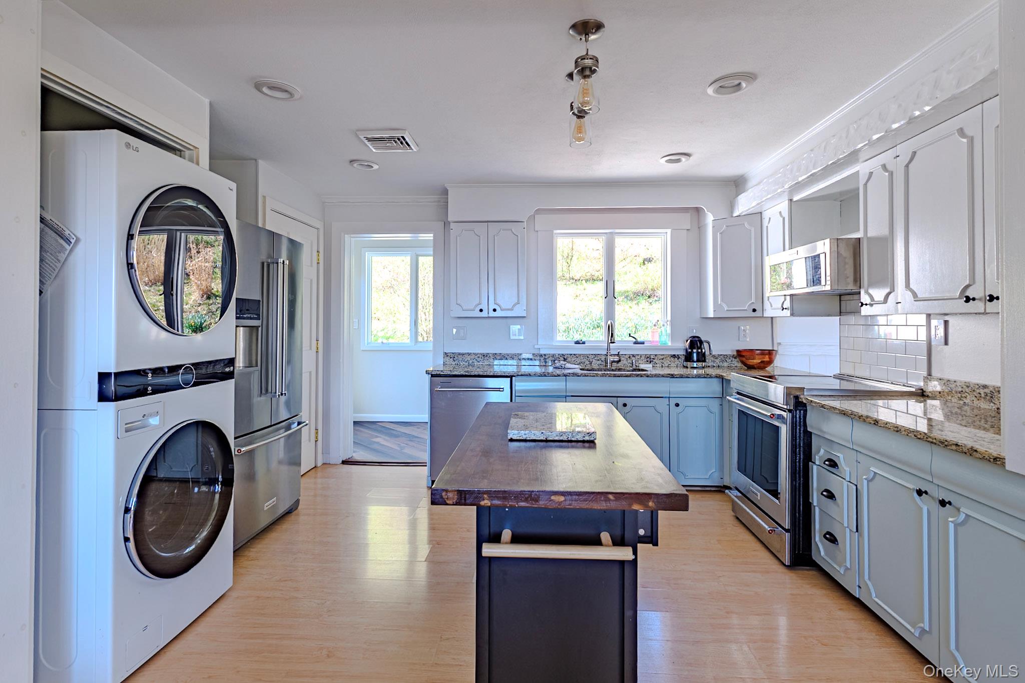 8 Horizon Road Cornwall, NY 12518 - Photo 12 of 35 a large kitchen with stainless steel appliances granite countertop a stove a sink a washer and dryer