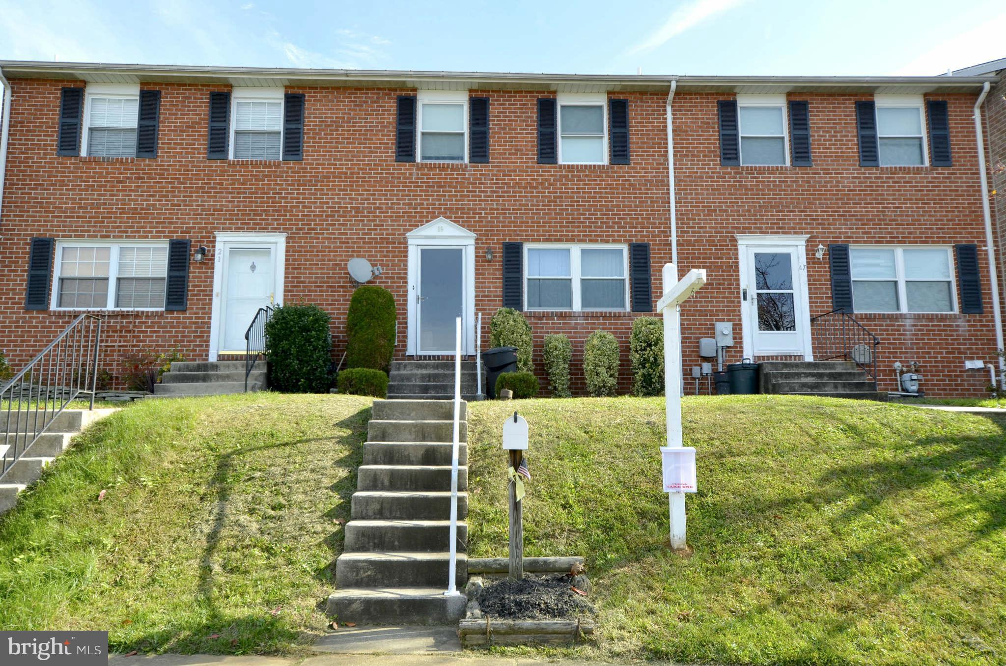 19 Pike Hall Place Baltimore, MD 21236 - Photo 1 of 30 a front view of a house with garden