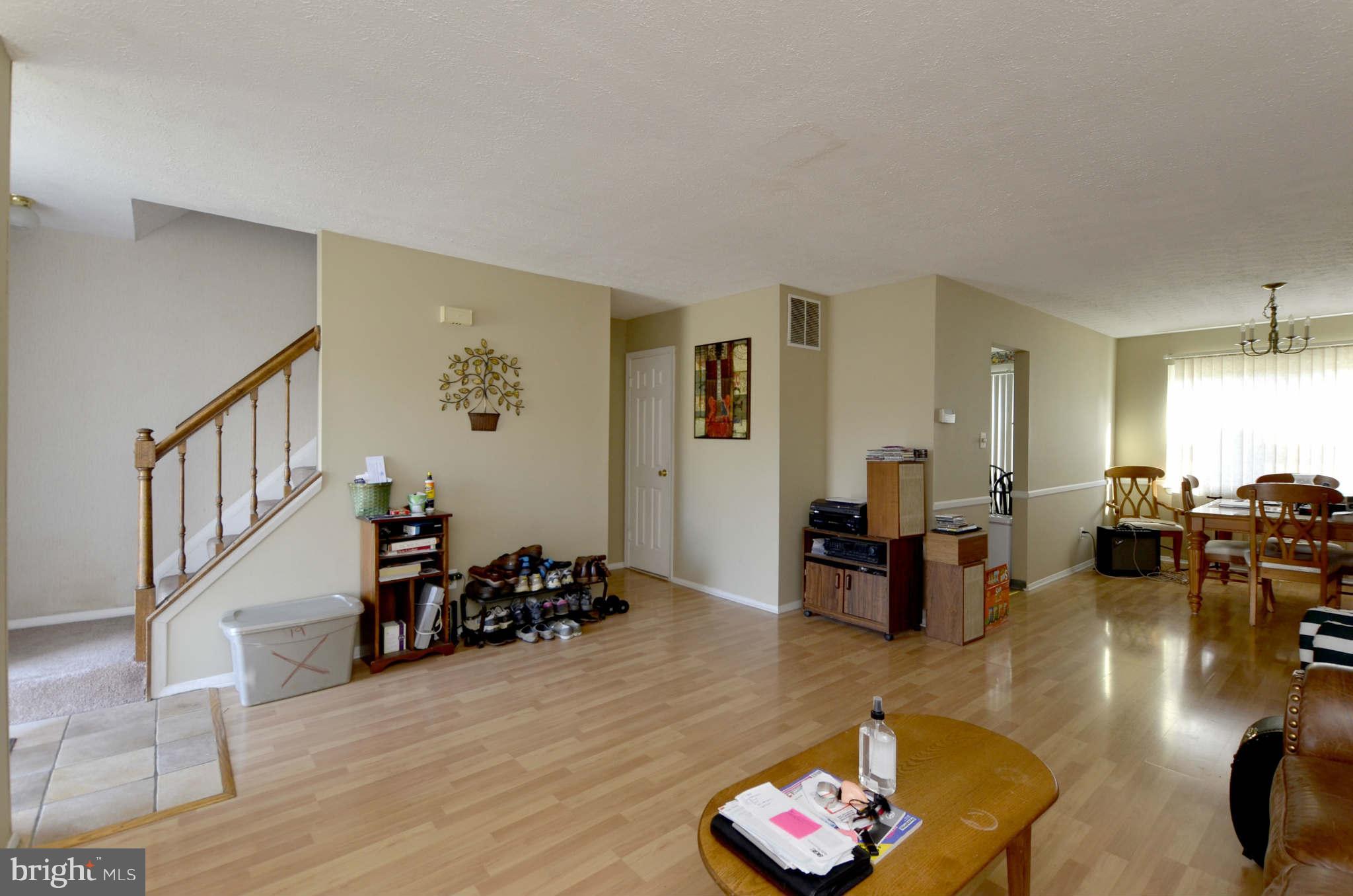 19 Pike Hall Place Baltimore, MD 21236 - Photo 2 of 30 a living room with furniture and a wooden floor