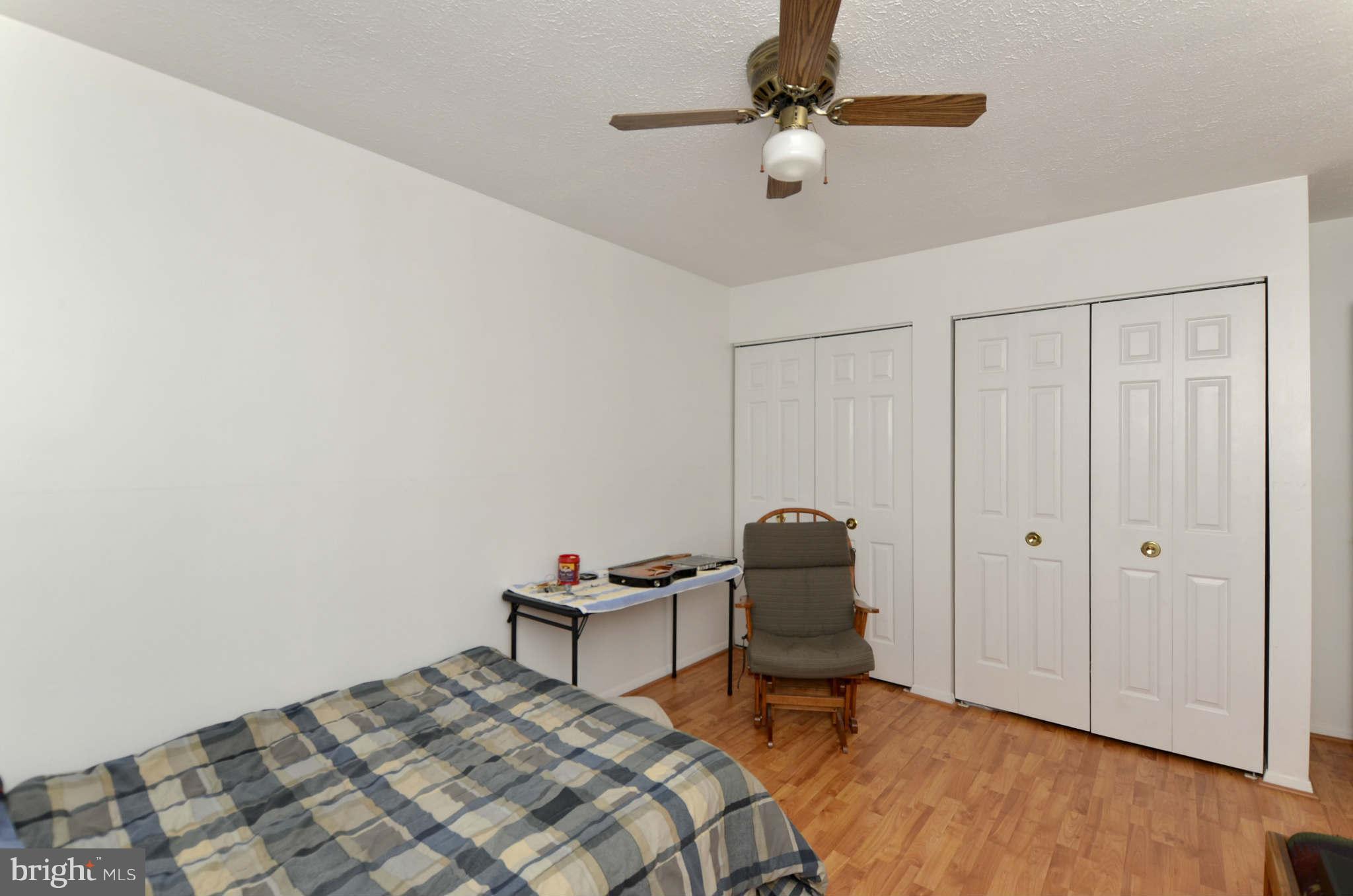19 Pike Hall Place Baltimore, MD 21236 - Photo 20 of 30 a bedroom with a bed and a chandelier