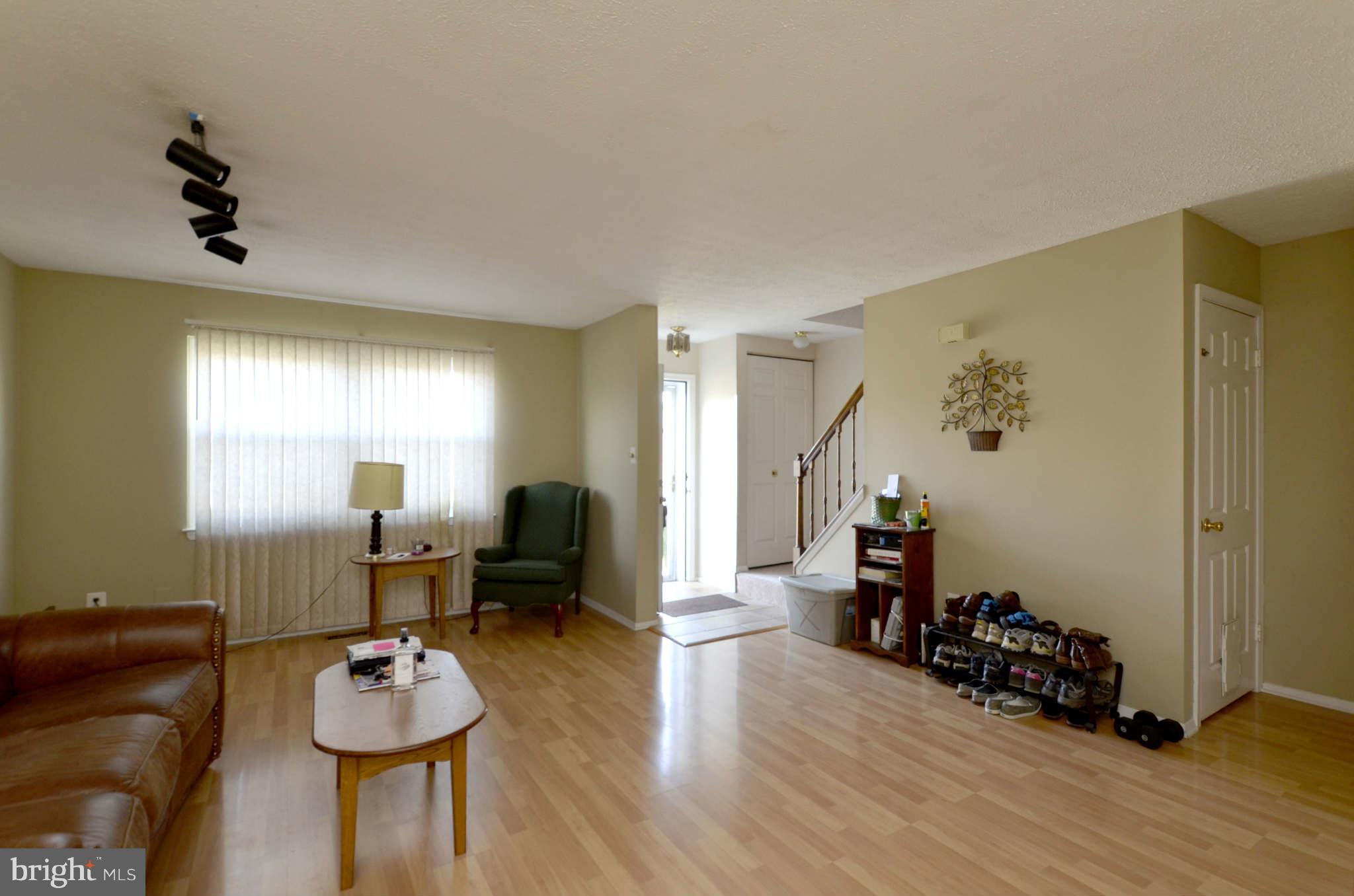 19 Pike Hall Place Baltimore, MD 21236 - Photo 3 of 30 a living room with furniture and wooden floor