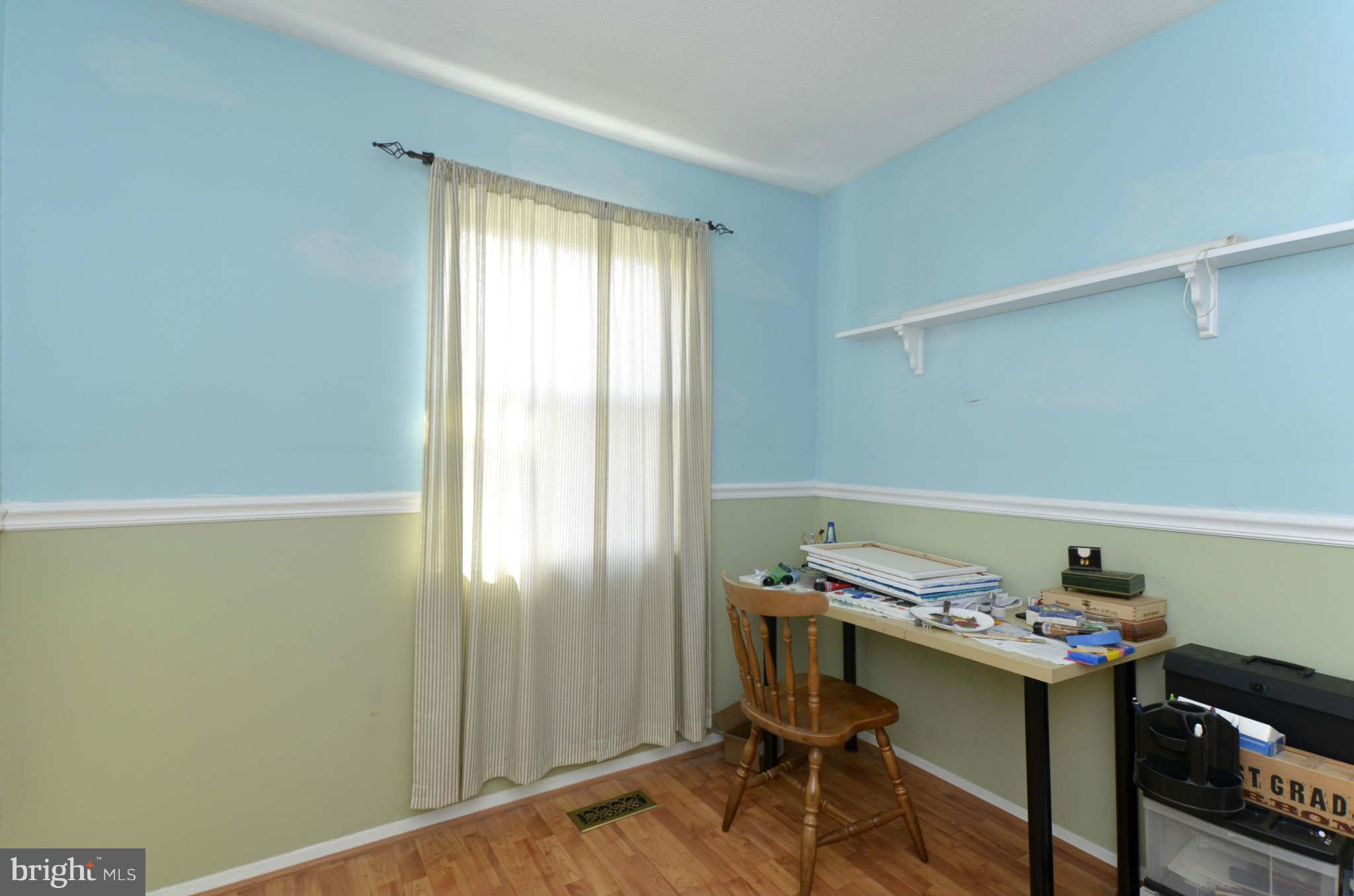 19 Pike Hall Place Baltimore, MD 21236 - Photo 22 of 30 a view of a workspace with furniture and a window