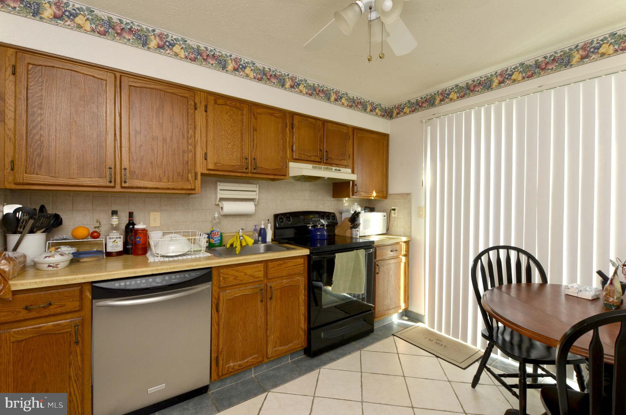 19 Pike Hall Place Baltimore, MD 21236 - Photo 8 of 30 a kitchen with a cabinets a sink and appliances