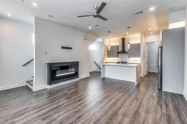 a view of kitchen with cabinets and wooden floor