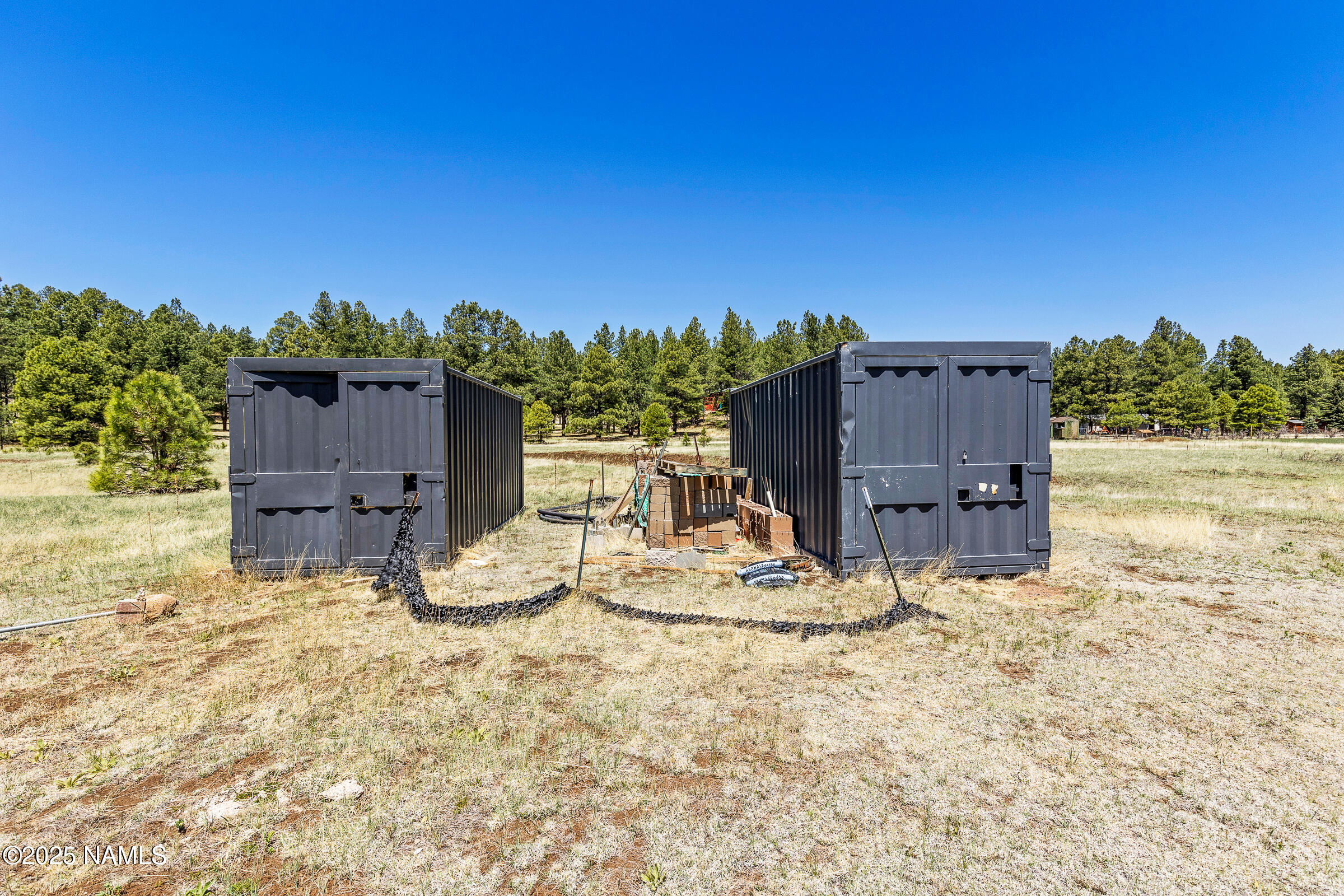 5984 Antelope Road Flagstaff, AZ 86005 - Photo 4 of 12 a view of a chairs and table in the backyard