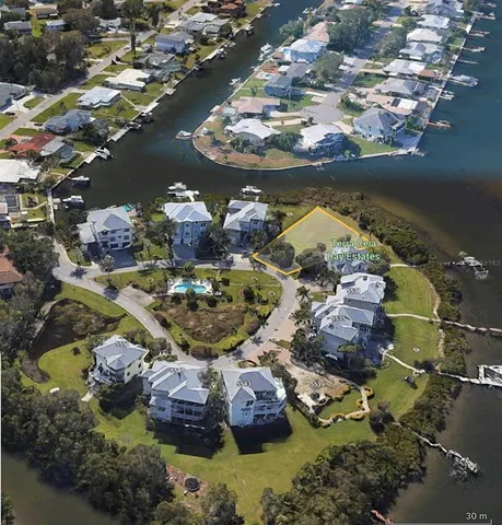 an aerial view of residential houses with outdoor space