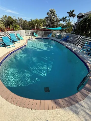 a view of a swimming pool with a yard