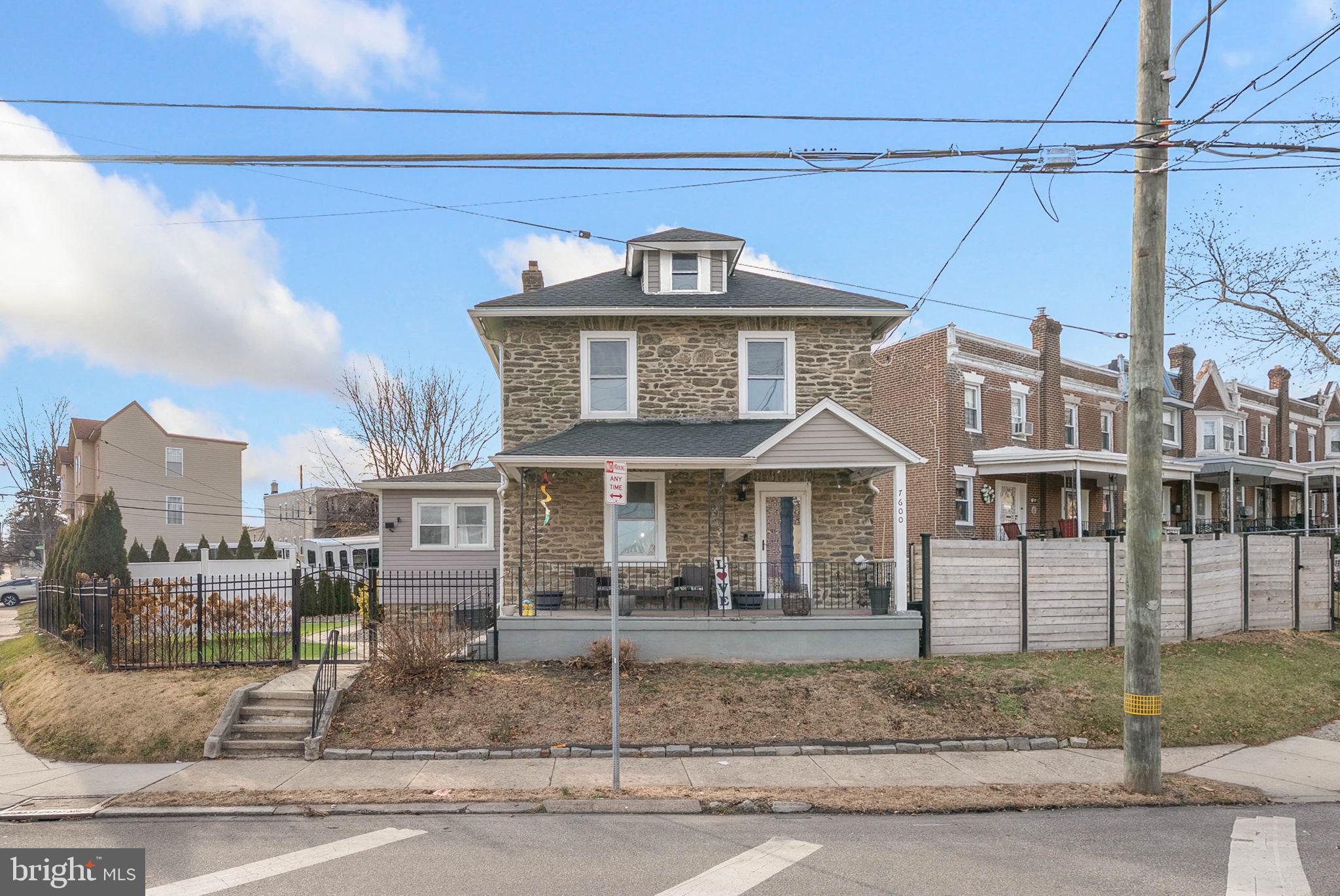 7600 Fayette Street Philadelphia, PA 19150 - Photo 1 of 32 a front view of a house with a yard