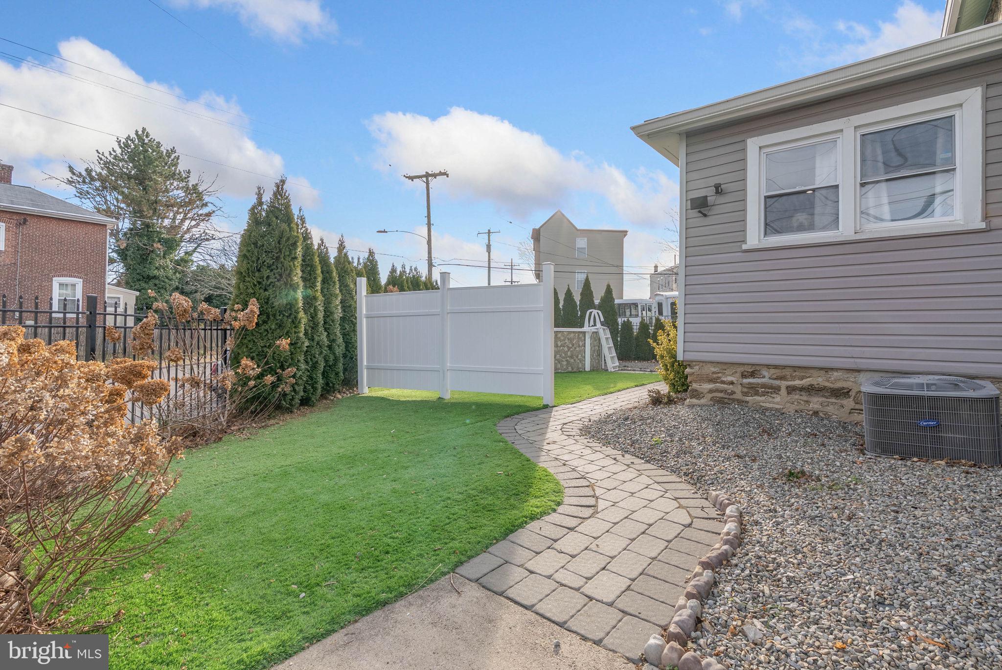 7600 Fayette Street Philadelphia, PA 19150 - Photo 3 of 32 a front view of a house with garden