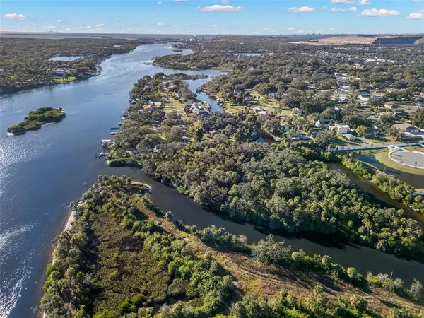 an aerial view of a houses with a lake view