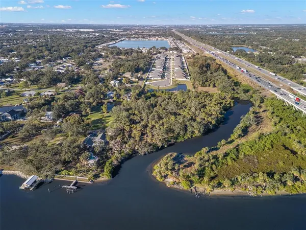 an aerial view of a houses with a yard