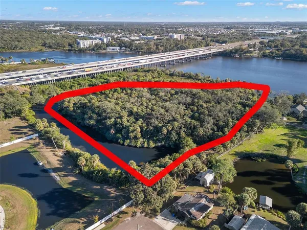 an aerial view of a house with a lake view